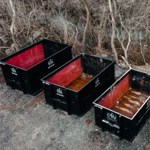 Different sizes of disposal bins lined up at storage yard